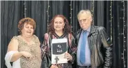  ?? Picture: MICHAEL SHEEHAN ?? HARD WORK PAYS: E-Square Education Campus board members Lilian, left, and Le Roux Niemann present a recognitio­n award to executive principal Malanie Ferreira, centre, at the school’s staff recognitio­n awards held at the Boardwalk last Saturday