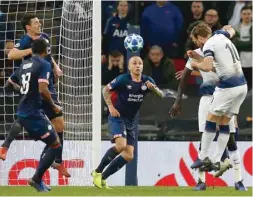  ?? (AFP) ?? Tottenham Hotspur’s Harry Kane (right) scores against PSV Eindhoven during the Champions League group B match at Wembley Stadium in London.