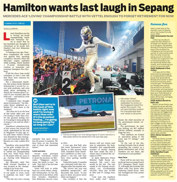  ?? Rex Features AFP ?? Mercedes driver » Flames emerge from the failing engine of Lewis Hamilton’s Mercedes before he retired from the race last year. Mercedes’ British driver Lewis Hamilton celebrates his victory in the Singapore Grand Prix earlier this month. The win saw...