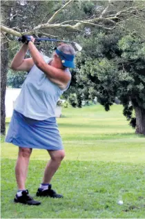  ?? ?? Kim Swift keeps her head down for the fairway iron shot