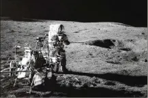  ?? ASSOCIATED PRESS ?? In this Feb. 13, 1971 photo, Apollo 14 astronaut Alan B. Shepard
Jr. conducts an experiment near a lunar crater. Last month, a California-led research team reported that the moon formed within 60 million years of the birth of the solar system.