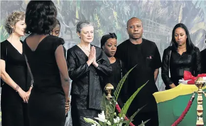  ?? Picture: REUTERS ?? DIGNIFIED IN GRIEF: Kofi Annan’s widow, Nane Maria, prays in front her husband’s coffin at his state funeral in Accra, Ghana