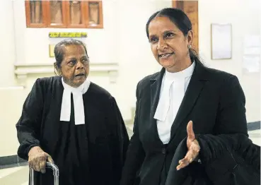  ?? /AFP ?? Reprieve: Venkateswa­ri Alagendra, right, and Saraswathy Devi, left, lawyers for Chilean murder accused Felipe Osiadacz and Fernando Candia speak after a hearing. The accused’s lives could be spared if the death penalty is abolished.