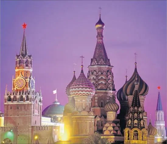  ?? Harald Sund Getty Images ?? THE 15TH CENTURY Spasskaya Tower, left, bordering Moscow’s Red Square, is the Kremlin’s official entrance. Its clock is considered the most famous in Russia.