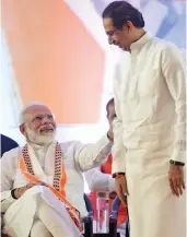  ?? — PTI ?? Prime Minister Narendra Modi with Shiv Sena president Uddhav Thackeray at an election rally ahead of Maharashtr­a Assembly elections, in Mumbai.