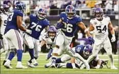  ?? Stephen Maturen / Getty Images ?? The Giants’ Saquon Barkley rushes for a touchdown against the Vikings during the fourth quarter on Dec. 24 in Minneapoli­s.