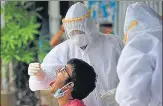  ?? HT PHOTO ?? ■
Medics take a swab sample from a person in Kolkata.