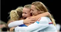  ?? AP ?? Katerina Siniakova (left), of the Czech Republic celebrates with teammates after defeating Sofia Kenin of the US. —