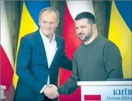  ?? Associated Press ?? POLISH PRIME MINISTER Donald Tusk, left, with Ukrainian President Volodymyr Zelensky on Monday in Kyiv, announced a new military aid package.