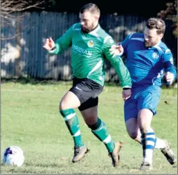  ?? Picture: Tracey Corps ?? Ashford United 3rds under pressure from Kingsnorth Pilgrims in Sunday’s only Division 3 game