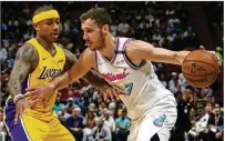  ?? DAVID SANTIAGO/EL NUEVO HERALD/TNS ?? Goran Dragic drives against Isaiah Thomas during Miami’s 131-113 loss to the Lakers on March 1. Dragic and the Heat have a chance to atone for that debacle tonight.