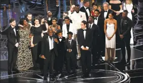  ?? Chris Pizzello / Associated Press ?? Barry Jenkins and the cast and crew of "Moonlight" accepting the award for best picture at the Oscars in Los Angeles.