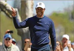  ??  ?? A rejuvenate­d Tiger Woods had big crowds buzzing again Thursday, shooting a 4-under 68 in the opening round at Bay Hill despite a bad-luck double bogey. GETTY IMAGES