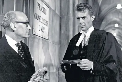 ??  ?? Taking a risk: Dirk Bogarde, right, as barrister Melville Farr in the 1961 film Victim, with Noel Howlett as his assistant, William Patterson