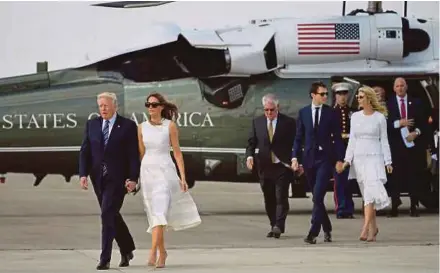  ?? AFP PIC ?? United States President Donald Trump (left), First Lady Melania Trump (second from left), White House senior adviser Jared Kushner (fourth from left) and Ivanka Trump at Ben Gurion Internatio­nal Airport in Tel Aviv last Tuesday. Kushner is married to...