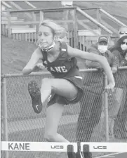  ?? Photo by Larry Smith ?? Sienna Conklin clears a hurdle at Wednesday's Middle School track meet.