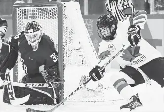  ?? CANADIAN PRESS FILE PHOTO ?? United States goaltender Madeline Rooney makes a save on Canada forward Blayre Turnbull during first-period women’s gold-medal final Olympic hockey action at the 2018 Olympic Winter Games.