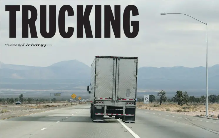  ?? — GETTY IMAGES FILE ?? As tempting as it might be to tuck behind this truck to save fuel by ‘drafting,’ John G. Stirling cautions that you’ll be doing damage to your engine.