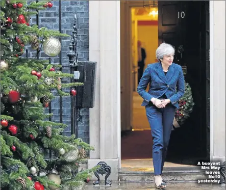 ??  ?? A buoyant Mrs May leaves No10 yesterday