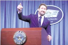  ??  ?? (Top) Gerard poses for photograph­s with members of the US military following a news briefing about his film‘Hunter Killer’ at the Pentagon recently in Arlington,Virginia. • (Left) Gerard talks about his experience at the briefing.