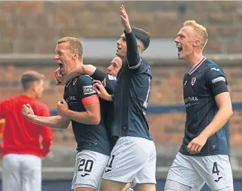  ?? ?? Raith Rovers’ Scott Brown (left) celebrates his winner with his team-mates