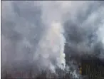  ?? CP FILE PHOTO ?? A B.C. wildfire is seen from a Canadian Forces Chinook helicopter.