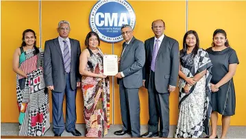  ??  ?? The ACCA Team and CMA Team in Sri Lanka at the MOU signing event.