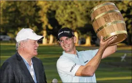  ?? ERIC RISBERG / ASSOCIATED PRESS ?? Brendan Steele (right, with Hall of Famer Johnny Miller) holds up the trophy after his second consecutiv­e Safeway Open victory on Sunday.