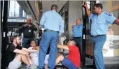  ?? PICTURE: DAVID RITCHIE ?? Reclaim the City protesters, including activist Zackie Achmat, block the entrance to the provincial Transport and Public Works building in protest at not getting any feedback on the Tafelberg land issue earlier this week. When police arrived, they...