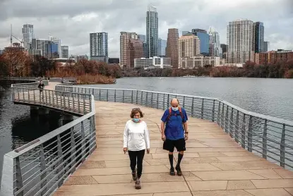  ?? Tamir Kalifa / Getty Images ?? The Ann and Roy Butler Hike and Bike Trail is among the features of Austin. The city has bumped Los Angeles from the top spot in the country because of Austin’s resilient labor market and outlook for steady growth, the CBRE Group reports.