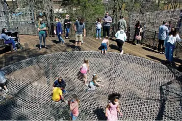  ?? The Sentinel-Record/Tanner Newton ?? ■ Children play in the Rope Bowl on the Bob Wheeler Science Skywalk at Mid-America Science Museum on Friday, the day after the museum’s largest attendance since 2015.