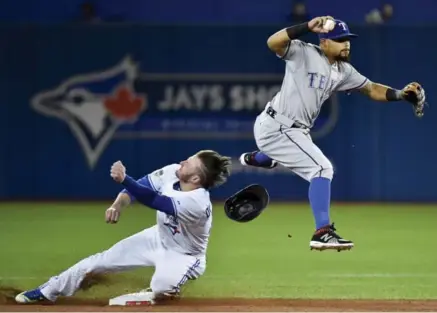  ?? NATHAN DENETTE/THE CANADIAN PRESS ?? The Jays’ Josh Donaldson was hurt on this play Thursday while being forced out at second base by the Rangers’ Rougned Odor.