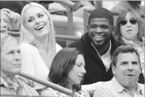  ?? The Canadian Press ?? Lindsey Vonn, left, and P.K. Subban talk with friends during the U.S. Open in New York on Sept. 8, 2019. Subban and the NHL are bringing a trivia show to television tonight.