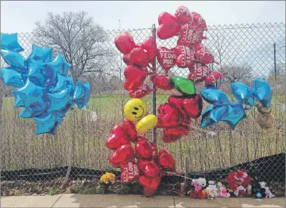  ??          ?? A makeshift memorial sits along a fence Monday, near where Robert Godwin Sr., was killed in Cleveland. Police said Steve Stephens killed Godwin on Sunday and posted the video on Facebook.
