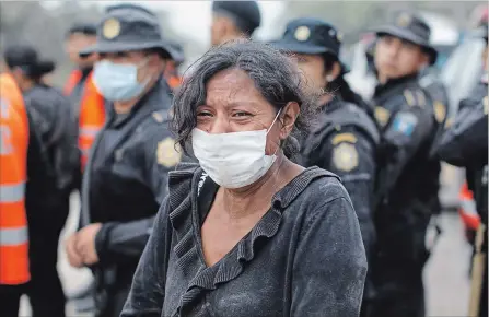  ?? LUIS SOTO THE ASSOCIATED PRESS ?? A resident cries after she was evacuated from her home in Escuintla, Guatemala, Monday.