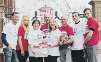  ??  ?? From left, Steven Natton, Aimee Warris, Catrina Flynn, from St Benedict’s Hospice, Richard Devlin, from The Brain Tumour Charity, Alison Warris, Nev Harris, Michael Warris and Daniel Warris.