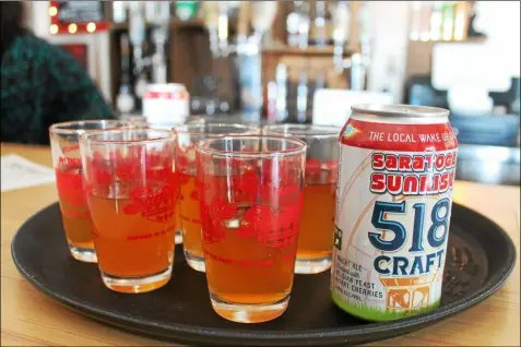  ?? FILE PHOTO ?? Craft beer like this Saratoga Sunrise wheat ale is served at a ribbon cutting event in 2018for 518Craft and The Shmaltz Shop.