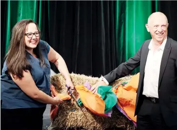  ??  ?? Member for Eastern Victoria Harriet Shing cuts a hay bale with Food & Fibre Gippsland co–deputy chair Stuart Quigley to officially launch the new organisati­on.