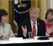 ?? SUSAN WALSH — THE ASSOCIATED PRESS ?? President Donald Trump, center, speaks as he meets with Republican senators on health care in the East Room of the White House in Washington, Tuesday. Sen. Susan Collins, R-Maine, left, and Sen. Lisa Murkowski, R-Alaska, right, listen.