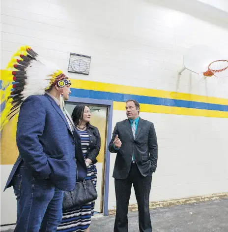  ?? LIAM RICHARDS ?? Saskatoon Tribal Council Chief Mark Arcand and Diane Boyko, chair of Greater Saskatoon Catholic Schools board, tour gym constructi­on at E.D. Feehan High School on Wednesday with principal Brandon Stroh. The school will house the First Nations Fitness and Wellness Academy.