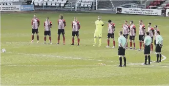  ??  ?? Sunderland team pay their respects.