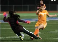  ?? RECORDER PHOTO BY CHIEKO HARA ?? Granite Hills High School goalie Ismenis Hernandez and Portervill­e’s Valeria Rios collide Wednesday, during the first half at Rankin Stadium.