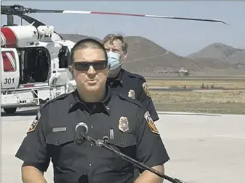  ?? Cal Fire on Facebook ?? JOSHUA BISCHOF speaks during a Fire Hawk helicopter’s unveiling at the Hemet Ryan Air Attack Base.