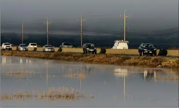  ?? PHOTOS BY ALAN DEP — MARIN INDEPENDEN­T JOURNAL, FILE ?? Traffic on Highway 37passes Sears Point in Sonoma. The Metropolit­an Transporta­tion Commission is working on a $430 million plan to widen a 10-mile stretch of Highway 37between Sears Point and Mare Island.