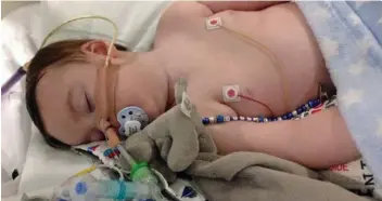  ??  ?? Hospital: Alfie Evans, 21 months, is brain-damaged from a rare neurologic­al condition