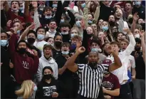  ?? KARL MONDON — STAFF PHOTOGRAPH­ER ?? Fans celebrate Sacred Heart Prep beating Bellarmine in a CCS Open Division basketball playoff game on Friday in Atherton.