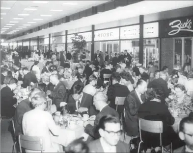  ?? COURTESY OF FAIRVIEW PARK ?? Guests eat dinner at the grand opening of Fairview Park in 1966. The mall had 45 stores when it opened.