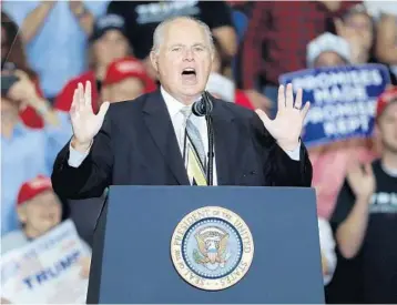  ?? JEFF ROBERSON/AP ?? Radio personalit­y Rush Limbaugh introducin­g President Donald Trump at the start of a 2018 campaign rally in Cape Girardeau, Mo. Limbaugh, the talk radio host who became the voice of American conservati­sm, has died of lung cancer.