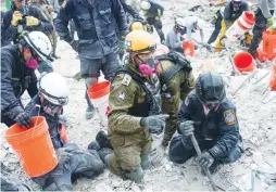  ?? (IDF) ?? ‘THE SITUATION was very difficult for us to deal with, but it was amazing to work with the American search and rescue teams,’ Lt.-Col. Oz Gino said upon returning to Israel.