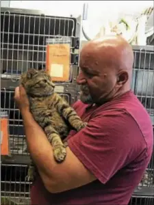  ??  ?? Providence Animal Center Humane Society Police Officer Ron Riggle and Buddy.